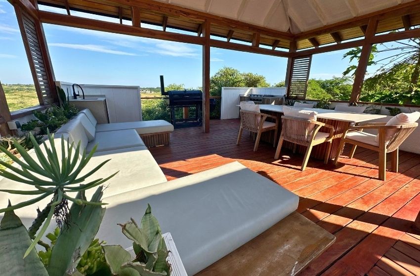 Braai and gazebo Exterior dining area with view of the pool Aloha 28 Ponta Mamoli
