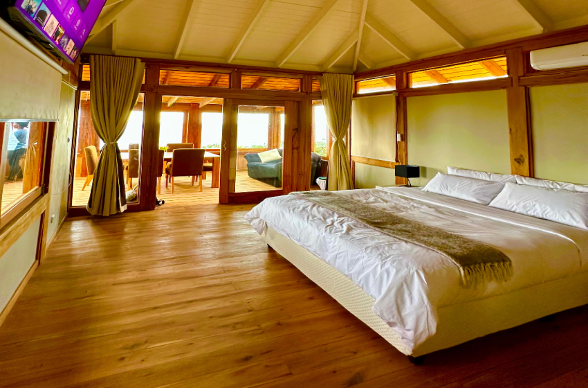 Bedroom with view of living room at V&K Peak in Ponta Mamoli
