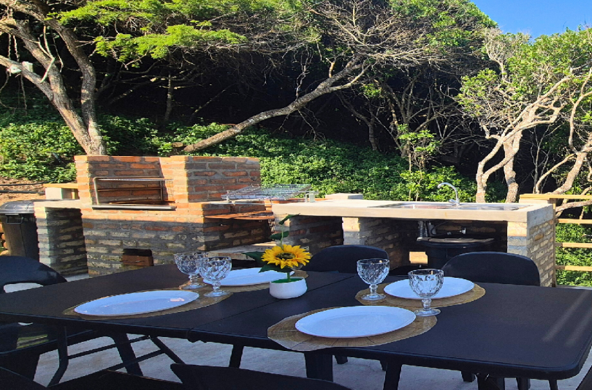 Exterior braai and dining area at V&K Peak in Ponta Mamoli