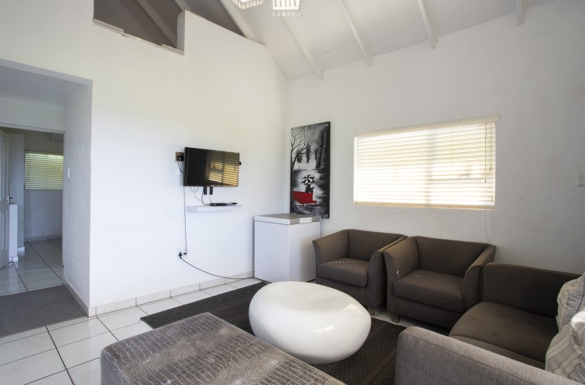 Living room with view of the loft at Baleia Azul 16 in Ponta Mamoli