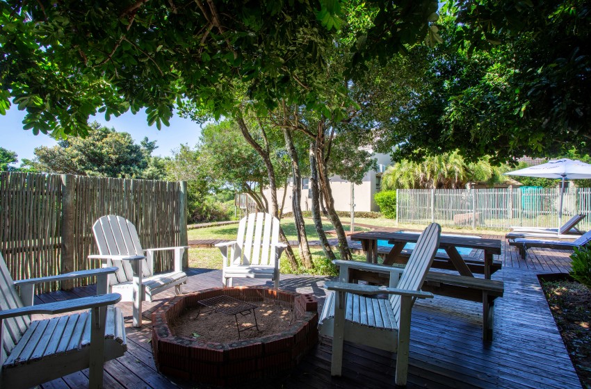 Fire pit and seating at Baleia Azul 16 in Ponta Mamoli