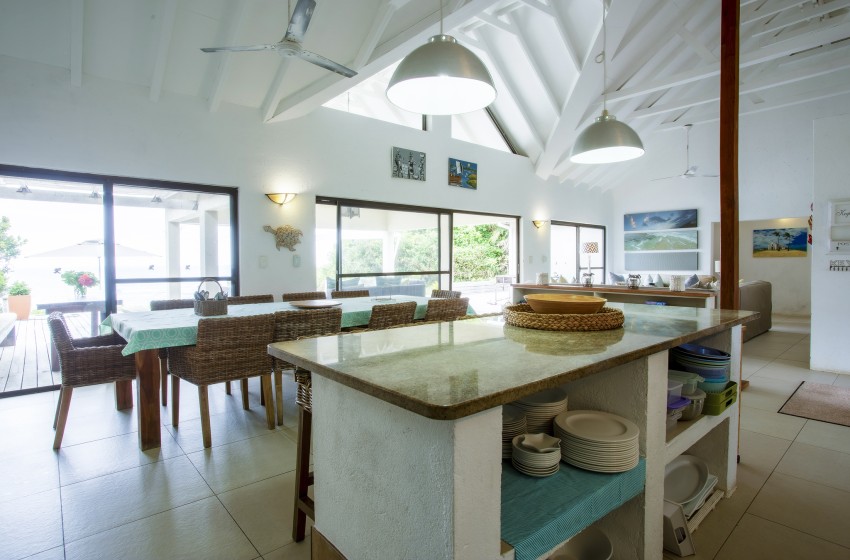 Kitchen with island at Baleia Azul 20 in Ponta Mamoli