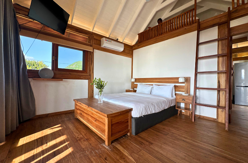 Bedroom and loft view at Honey's House in Ponta Mamoli