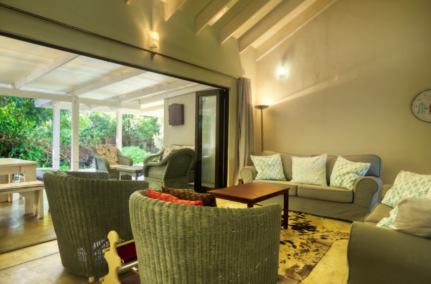 Lounge seating and view of bush at Baleia Azul 26 in Ponta Mamoli