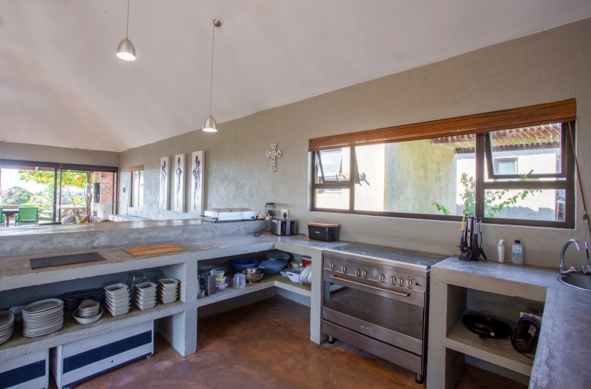 Kitchen with appliances in view at Baleia Azul 15 in Ponta Mamoli