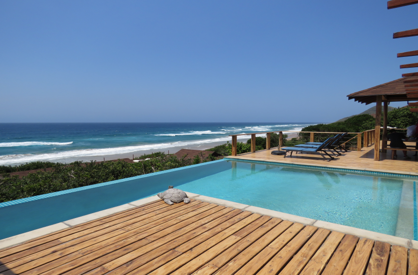 Swimming pool with sea view at Aloha 16 in Ponta Mamoli