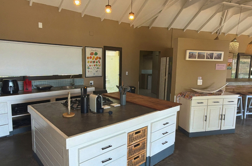 kitchen with island at Baleia Azul 11 in Ponta Mamoli