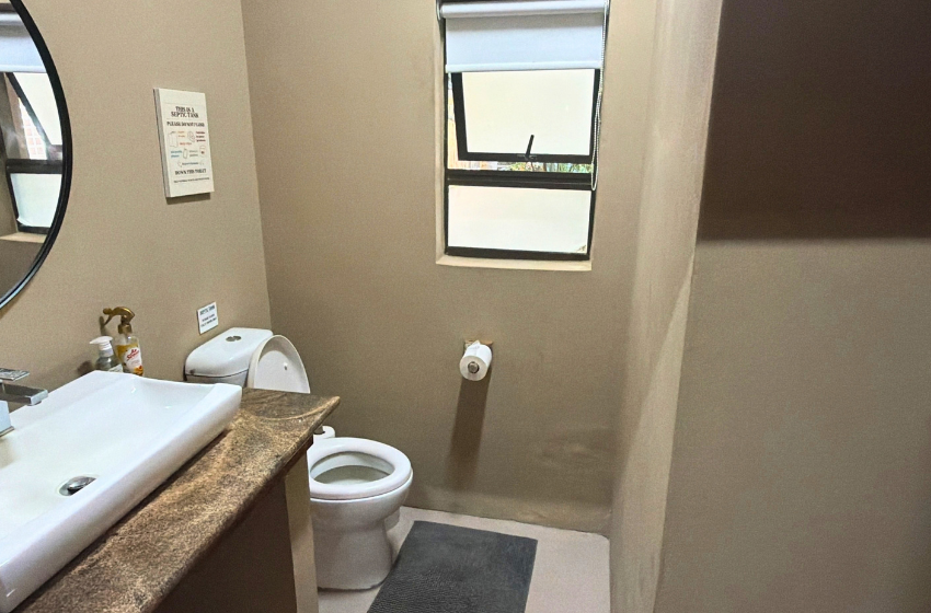 Bathroom and toilet view at Baleia Azul 11 in Ponta Mamoli