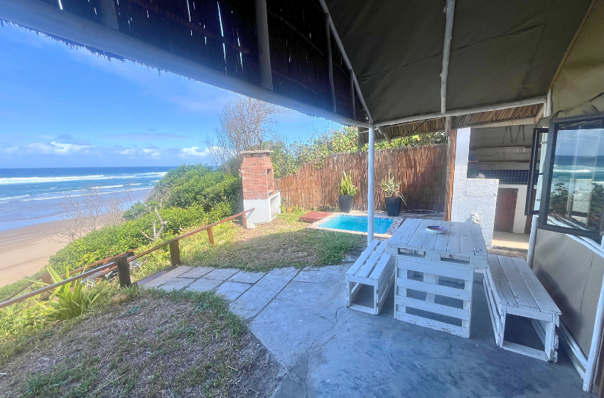 pool and seating at Baleia azul beachfront tent 8 in Ponta Mamoli