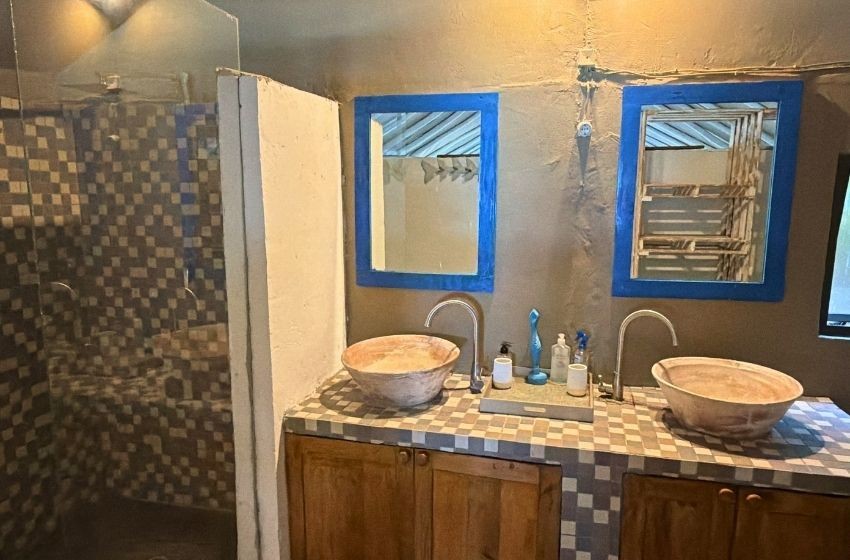 bathroom showing vanity at Baleia azul beachfront tent 8 in Ponta Mamoli