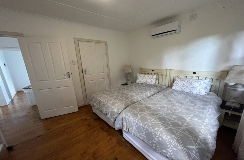 bedroom 3 with single beds at campismo ninho 28 in Ponta Malongane