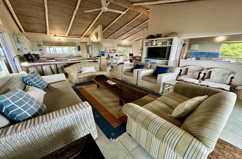 open plan kitchen and living area sea view from deck at kangela 11 in Ponta Malongane