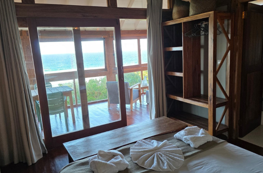 bedroom with sea view at Makana 3A chalet in Ponta Mamoli