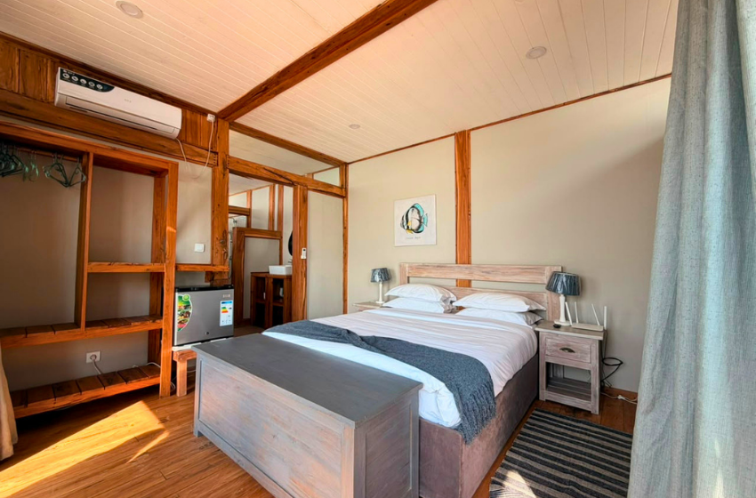 bedroom 1 with shelving at Makana 7A in Ponta Mamoli