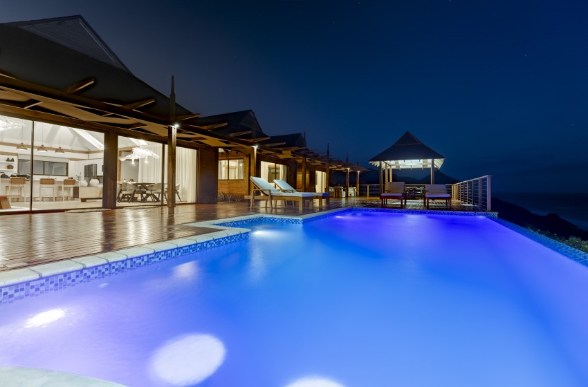 night view of the pool at Aloha 8 in Ponta Mamoli